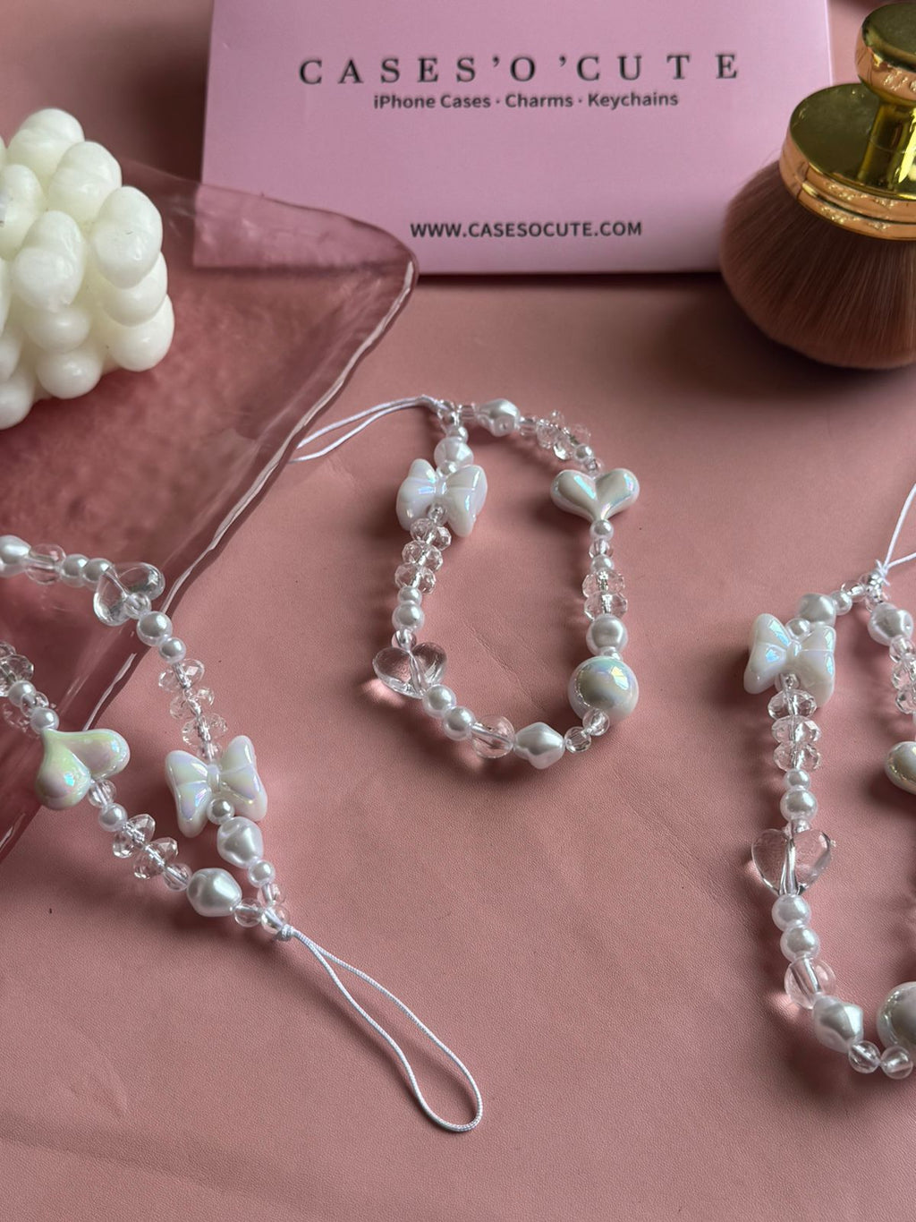 Pearl Bow Phone Charm showing the full beaded loop and cord tie